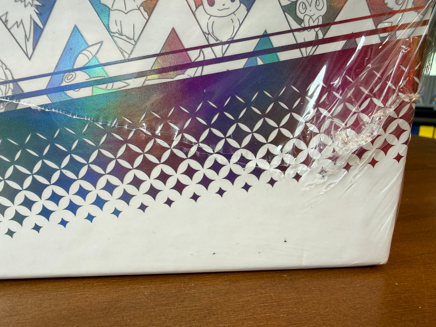 Prismatic Evolutions Super Premium Collection (SPC) (tear on bottom, see pics)